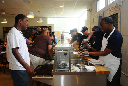 Members of the U.S. Navy feeding hungry Americans at a soup kitchen in Red Bank, New Jersey. ©U.S. Navy photo, by Mass Communication Specialist 3rd Class Cristina Gabaldon 